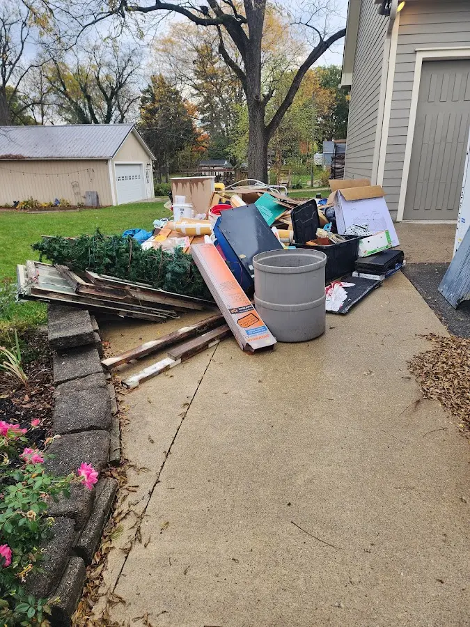 Dumpster being loaded with debris for Demolition Dumpster Rental in Louisville